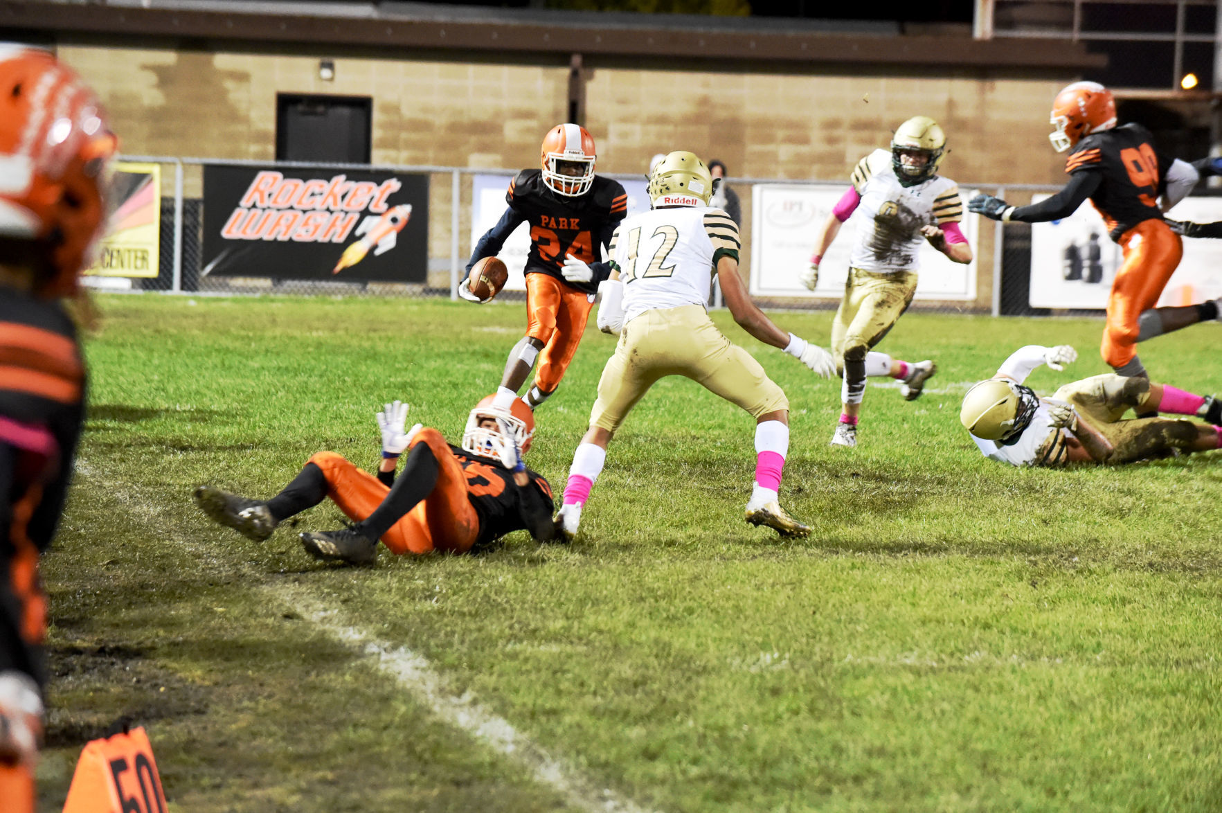 Park Senior Willie Adams has the ball, Case's Jayvian Farr looks to stop him